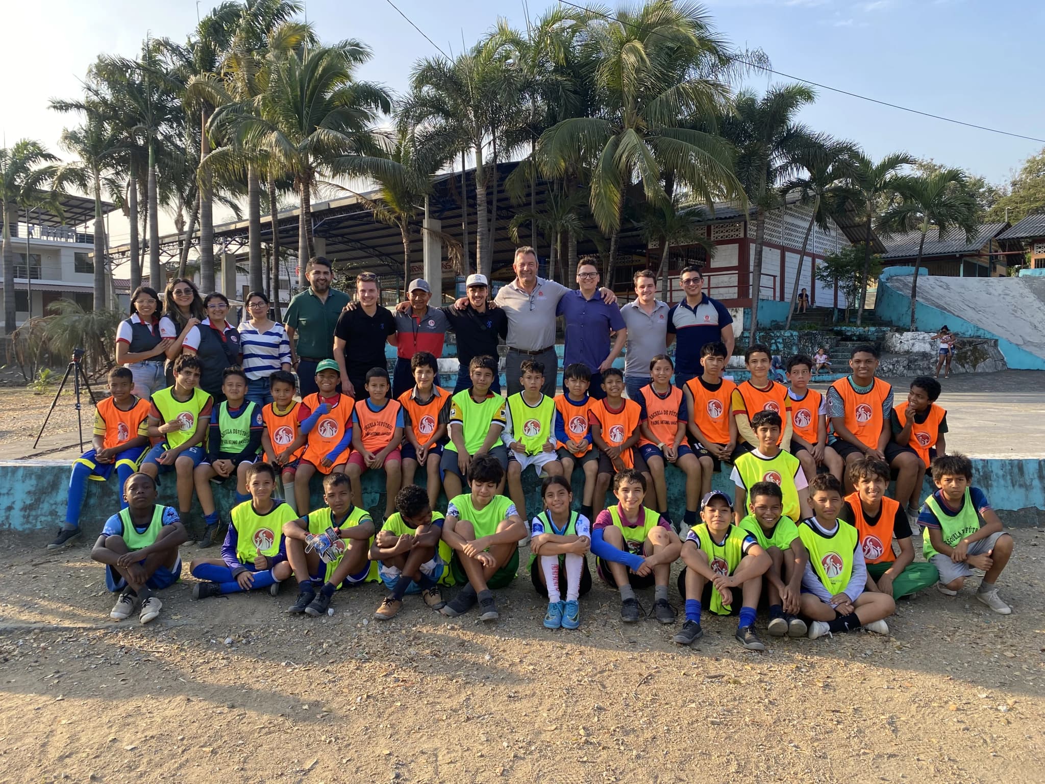 GolA.S.O players celebrating on a football pitch in Ecuador