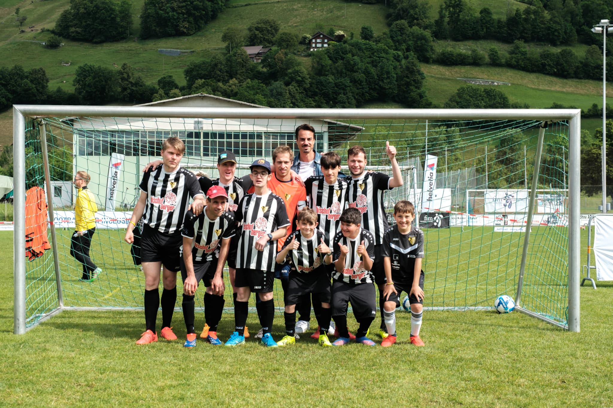 Disability football teams celebrating after a match
